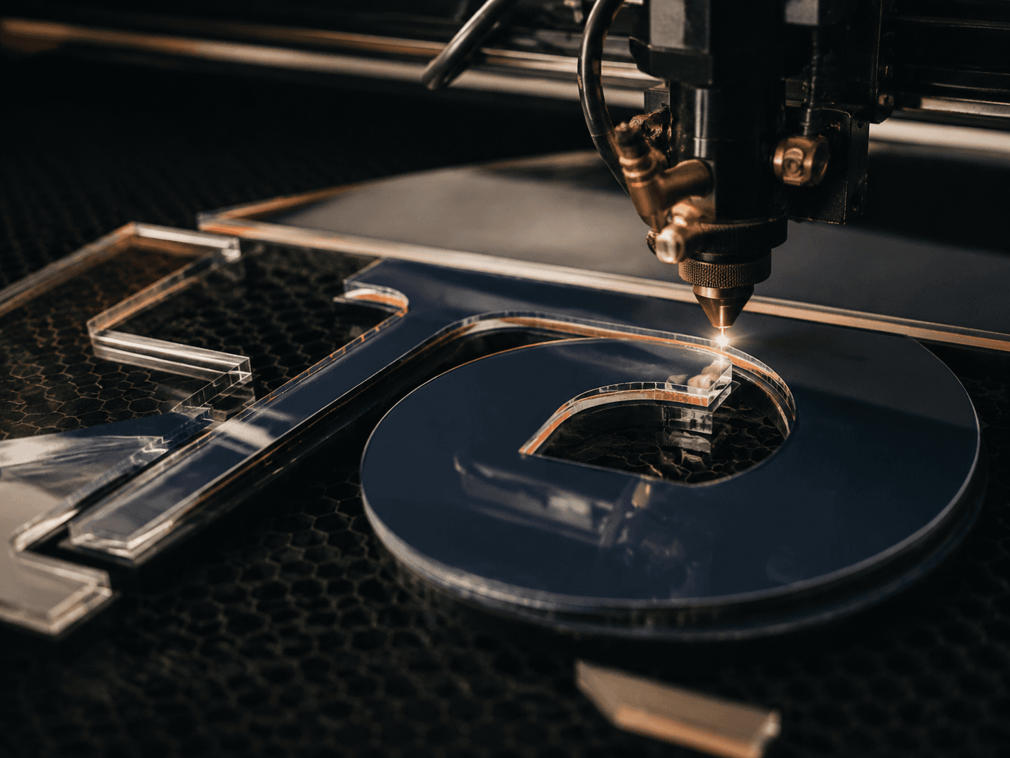 Precision laser cutting layered acrylic for dimensional signage